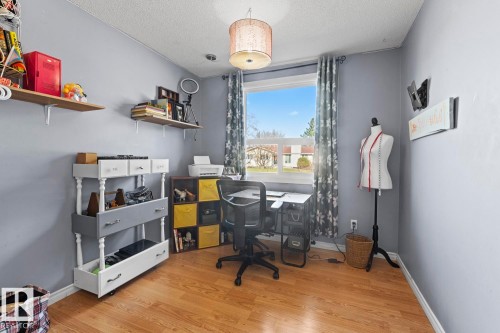 Room with light wood-finish flooring and light gray walls - 4908 59 Street, Cold Lake, AB - Indoor Photo Showing Office