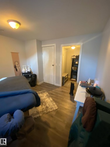The property features wood-style flooring and a flush mount light fixture - 5030 40 Street, Cold Lake, AB - Indoor