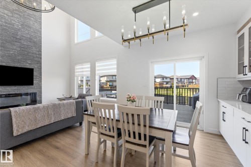 14 Enns Crest, Fort Saskatchewan, AB - Indoor Photo Showing Dining Room With Fireplace
