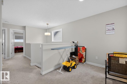 Upper level landing with neutral carpeting and light gray wall tones - 3214 9 Street, Edmonton, AB - Indoor