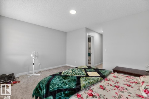 Bedroom featuring neutral-toned walls, recessed lighting, and carpet flooring - 3214 9 Street, Edmonton, AB - Indoor Photo Showing Bedroom