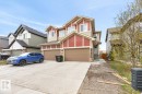 Modern multi-level exterior with red and beige siding, a double garage, and a front entryway with concrete steps - 3214 9 Street, Edmonton, AB  - Outdoor With Facade 