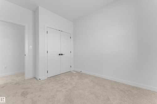 Neutral-toned carpeting and white walls provide a versatile interior palette - 171 Graybriar Drive, Stony Plain, AB - Indoor Photo Showing Other Room