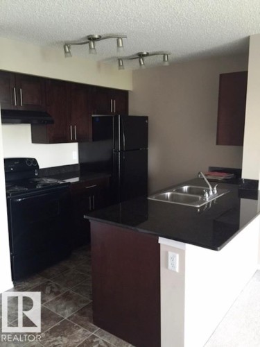 206 12035 22 Avenue Sw, Edmonton, AB - Indoor Photo Showing Kitchen With Double Sink