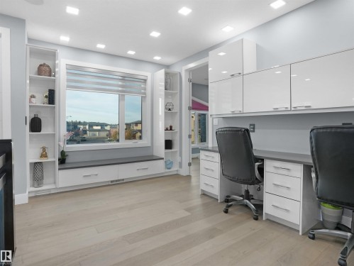 Dedicated office space featuring two built-in workstations with ample cabinetry and countertop space - 913 Wood Place, Edmonton, AB - Indoor Photo Showing Office