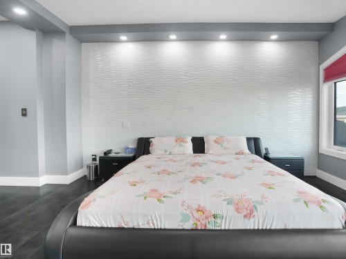Accent wall featuring textured white panels and recessed lighting - 913 Wood Place, Edmonton, AB - Indoor Photo Showing Bedroom
