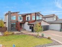 Contemporary multi-level residence featuring a stone and wood-panel exterior - 913 Wood Place, Edmonton, AB  - Outdoor With Facade 