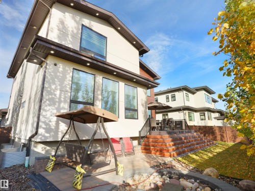 Contemporary exterior with light-toned stucco and dark trim - 913 Wood Place, Edmonton, AB - Outdoor