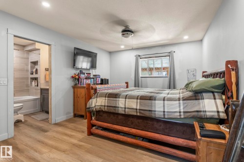 Room featuring wood-finish flooring, recessed lighting, and a ceiling fan - 23133 Twp Rd 502, Rural Leduc County, AB - Indoor Photo Showing Bedroom