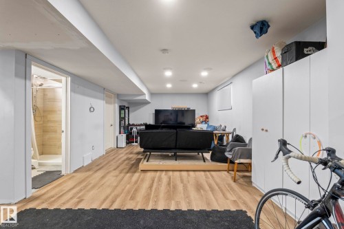 Open-concept room featuring wood-finish flooring, recessed lighting, and a white ceiling - 23133 Twp Rd 502, Rural Leduc County, AB - Indoor