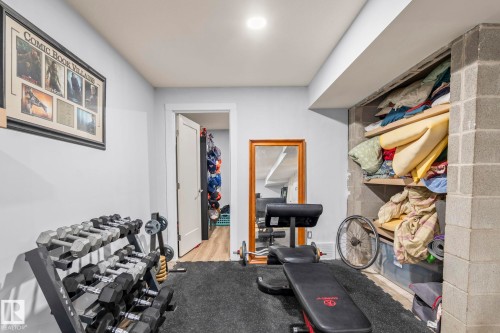 Finished lower level space with light gray walls, recessed lighting, and durable dark flooring - 23133 Twp Rd 502, Rural Leduc County, AB - Indoor Photo Showing Other Room