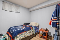 Light gray walls with a window featuring a white roller shade - 
