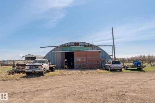 Quonset-style agricultural building featuring a corrugated metal exterior - 23133 Twp Rd 502, Rural Leduc County, AB - Outdoor