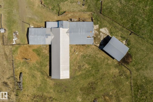 Aerial perspective showcasing multiple structures with metal roofing - 23133 Twp Rd 502, Rural Leduc County, AB - 