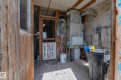 Utility space featuring exposed ceiling beams, concrete flooring, and a comprehensive HVAC system - 23133 Twp Rd 502, Rural Leduc County, AB - Indoor Photo Showing Basement