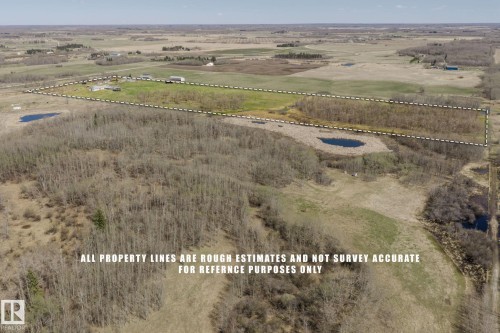 Expansive rural landscape featuring a mix of cleared land and wooded areas - 23133 Twp Rd 502, Rural Leduc County, AB - Outdoor With View
