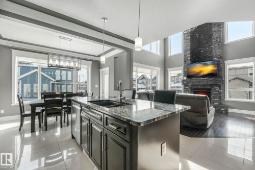 1360 Cunningham Drive, Edmonton, AB - Indoor Photo Showing Kitchen With Fireplace With Double Sink
