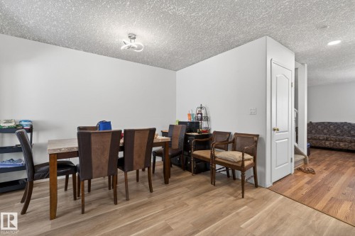Open-concept dining area featuring wood-finish flooring, white walls, and a recessed ceiling light - 4603 126 Avenue, Edmonton, AB - Indoor Photo Showing Dining Room