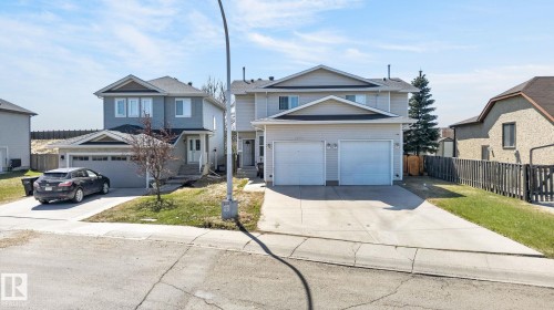 Two-story residence featuring a dual garage and a concrete driveway - 4603 126 Avenue, Edmonton, AB - Outdoor With Facade
