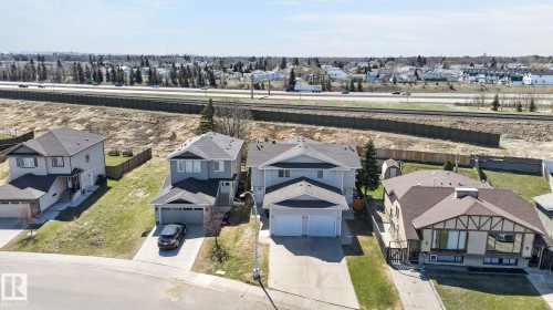 Contemporary two-story residence with light gray siding and a dark shingle roof - 4603 126 Avenue, Edmonton, AB - Outdoor