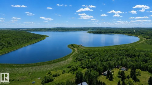 Expansive body of water surrounded by dense green forestry - 331 60417 Range Road 124, Rural St. Paul County, AB 