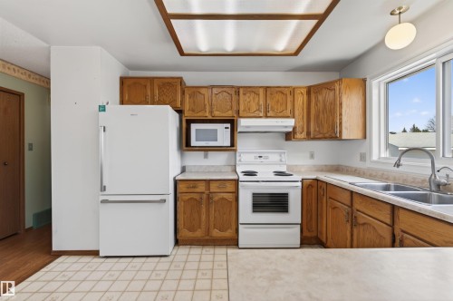2013 3 Avenue, Cold Lake, AB - Indoor Photo Showing Kitchen With Double Sink