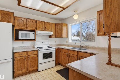 2013 3 Avenue, Cold Lake, AB - Indoor Photo Showing Kitchen With Double Sink