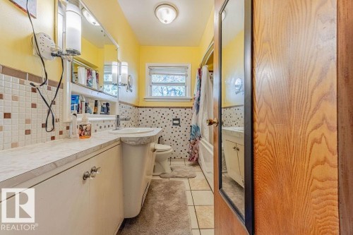 Hardwood-style flooring throughout - 12339 89 Street, Edmonton, AB - Indoor Photo Showing Bedroom