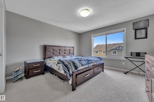 Wall-to-wall carpeting and neutral-toned walls - 5520 5 Avenue, Edmonton, AB - Indoor Photo Showing Bedroom