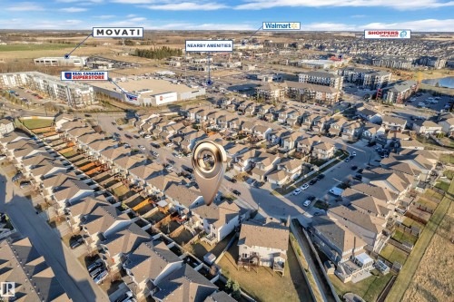 Aerial perspective showcasing residential properties and surrounding commercial establishments - 5520 5 Avenue, Edmonton, AB - Outdoor With View