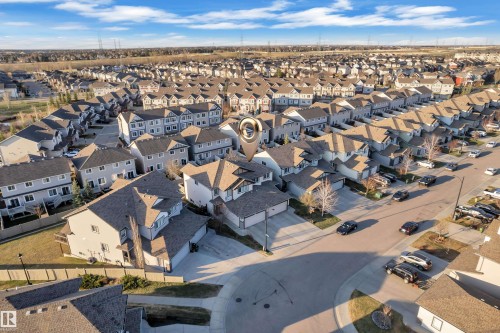 Aerial perspective of a developed residential area featuring a distinct property - 5520 5 Avenue, Edmonton, AB - Outdoor With View