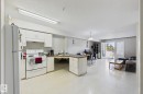 Open-concept living area with integrated kitchen - 220 80A Kelloway Crescent, Red Deer, AB  - Indoor Photo Showing Kitchen 