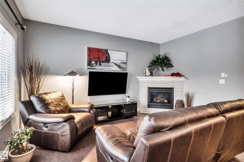 7728 18 Avenue, Edmonton, AB - Indoor Photo Showing Living Room With Fireplace