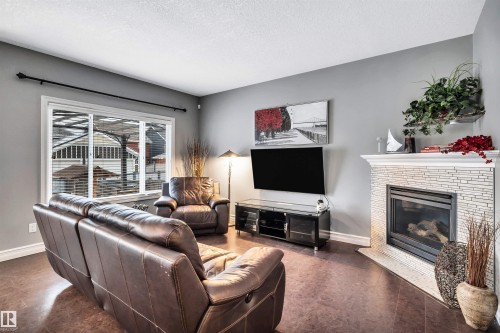 7728 18 Avenue, Edmonton, AB - Indoor Photo Showing Living Room With Fireplace