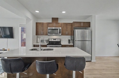 30 3025 151 Avenue, Edmonton, AB - Indoor Photo Showing Kitchen With Stainless Steel Kitchen With Double Sink With Upgraded Kitchen