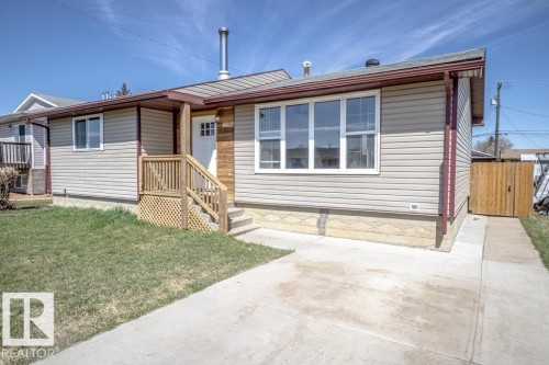 Single-story residence featuring light-colored siding and a contrasting dark fascia - 4822 45 Ave, St. Paul Town, AB - Outdoor