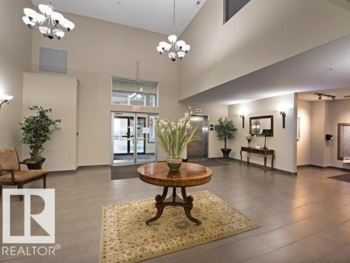 Spacious foyer featuring high ceilings and large format tile flooring - 109 160 Magrath Rd, Edmonton, AB 