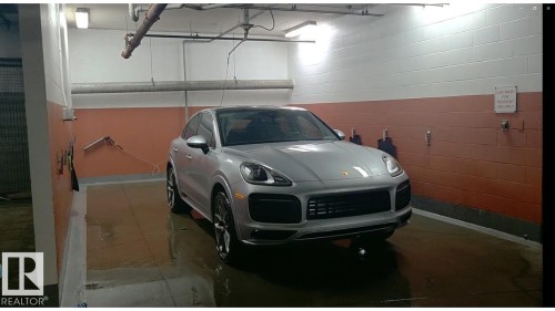 Dedicated car wash bay featuring durable block wall construction with a two-tone finish, overhead fluorescent lighting, and industrial-grade plumbing fixtures. - 109 160 Magrath Rd, Edmonton, AB 