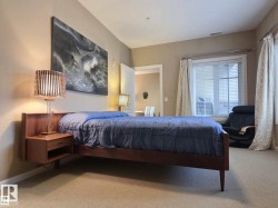 Bedroom featuring neutral-toned walls and carpet flooring - 