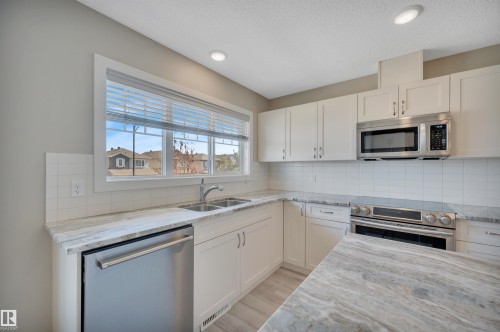 8 1530 Tamarack Boulevard, Edmonton, AB - Indoor Photo Showing Kitchen With Double Sink