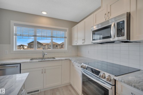 8 1530 Tamarack Boulevard, Edmonton, AB - Indoor Photo Showing Kitchen With Double Sink