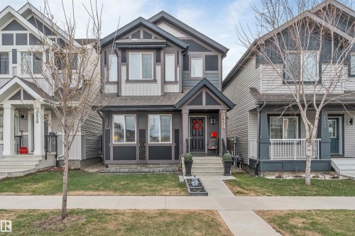 Two-story residence featuring a dark gray and light gray exterior with white trim accents - 2652 Maple Way, Edmonton, AB - Outdoor With Facade
