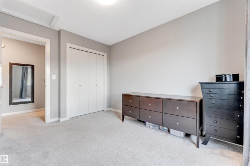 Soft gray wall tones with white trim throughout - 2652 Maple Way, Edmonton, AB - Indoor Photo Showing Bedroom