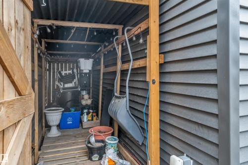 Outdoor storage shed with wood framing, corrugated metal roof, wood-plank flooring, and string lighting - 2652 Maple Way, Edmonton, AB -  With Exterior