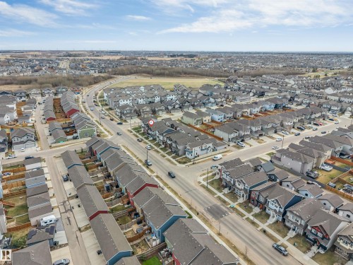 Aerial perspective showcasing a residential development with varied housing styles - 2652 Maple Way, Edmonton, AB - Outdoor With View