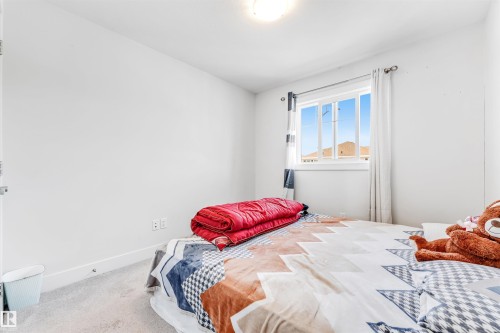 White walls featuring a single window with white trim and a white curtain rod - 1536 21 Street, Edmonton, AB - Indoor Photo Showing Bedroom