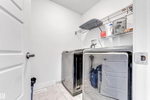 Dedicated laundry area featuring modern appliances - 1536 21 Street, Edmonton, AB - Indoor