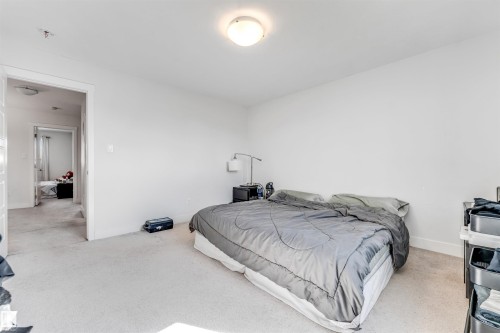 Bedroom featuring light-colored wall-to-wall carpeting and neutral white walls - 1536 21 Street, Edmonton, AB - Indoor Photo Showing Bedroom