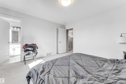 Carpeted bedroom with a built-in ceiling light fixture - 1536 21 Street, Edmonton, AB - Indoor Photo Showing Bedroom