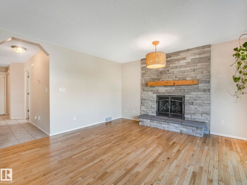 1060 Wedgewood Boulevard, Edmonton, AB - Indoor Photo Showing Living Room With Fireplace